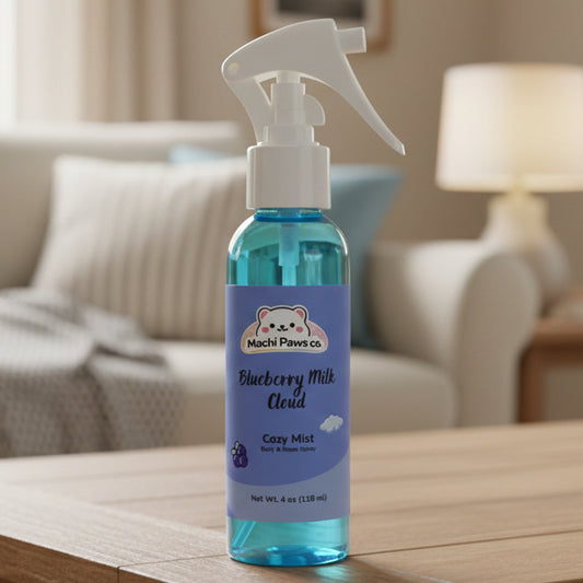 Bottle of Machi Paws Co. Blueberry Milk Cloud Cozy Mist on a wooden table with a blurred living room background.