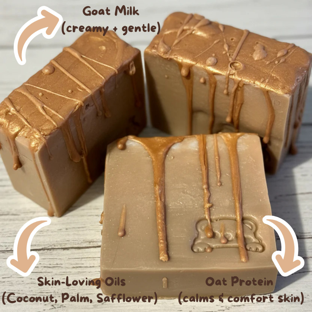Three blocks of brown soap with drizzle patterns on a wooden surface, labeled with ingredients and benefits.