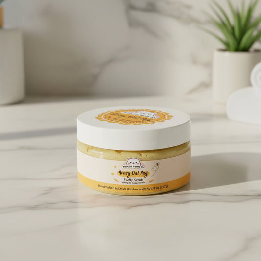 Jar of 'Honey Oat Hug' fluffy scrub from Mochi Paws co. on a white background