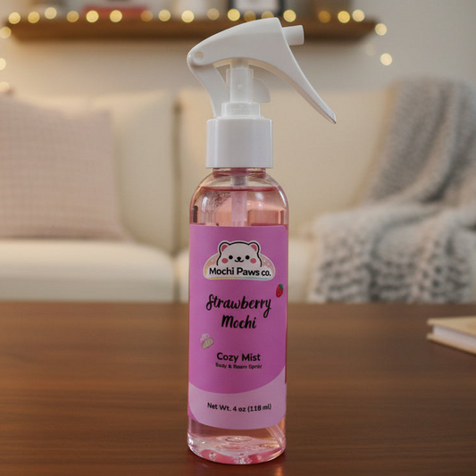 Bottle of strawberry-flavored product with a pink label on a wooden surface.