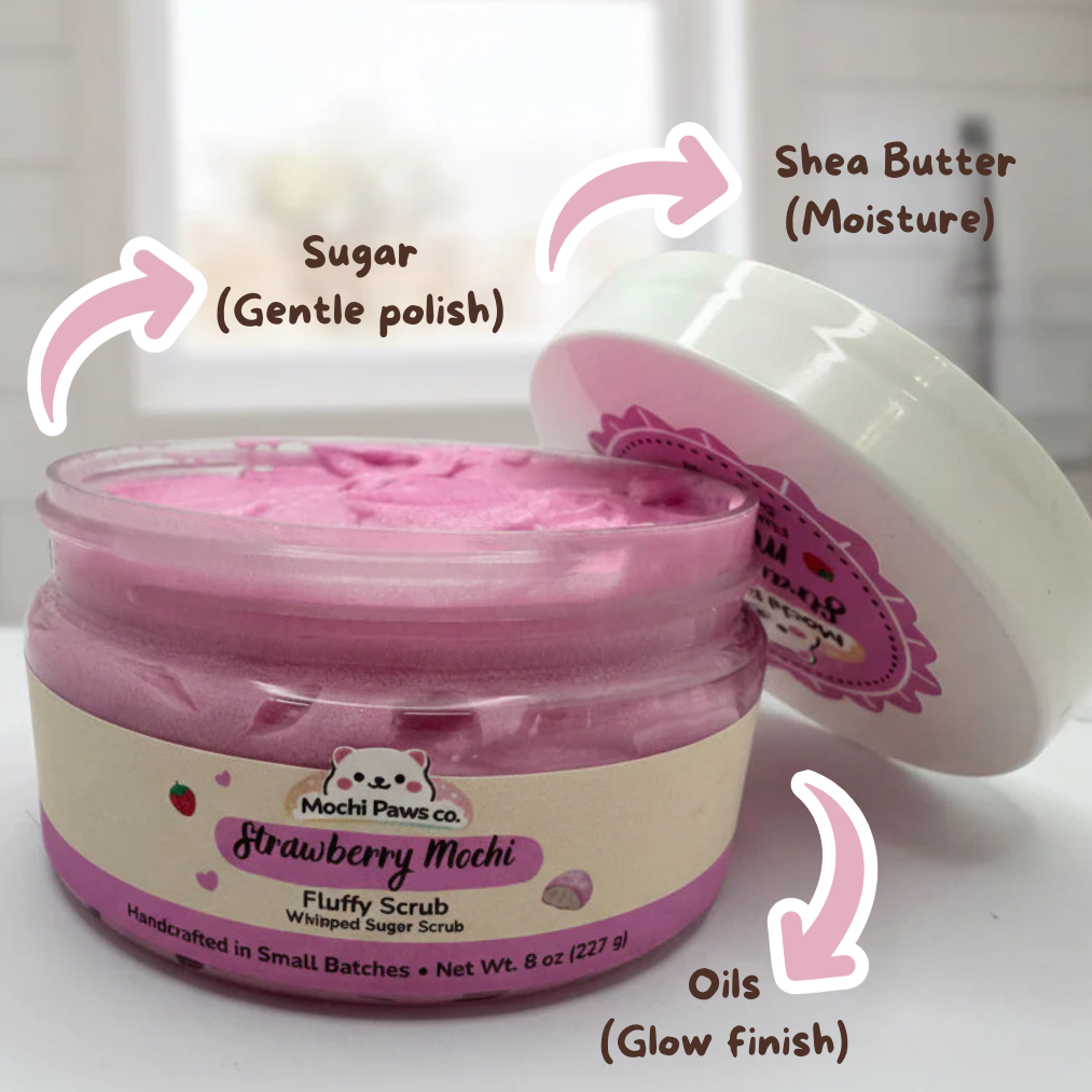 Pink jar of strawberry mochi scrub with text labels on a white background