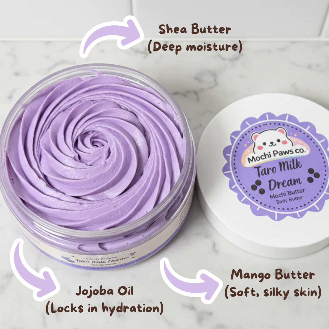 Purple body butter with labeled ingredients on a marble background