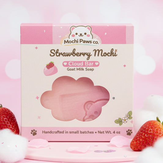 Pink cloud-shaped soap bar with 'Mochi Paws Co.' branding on a pink background with strawberries.